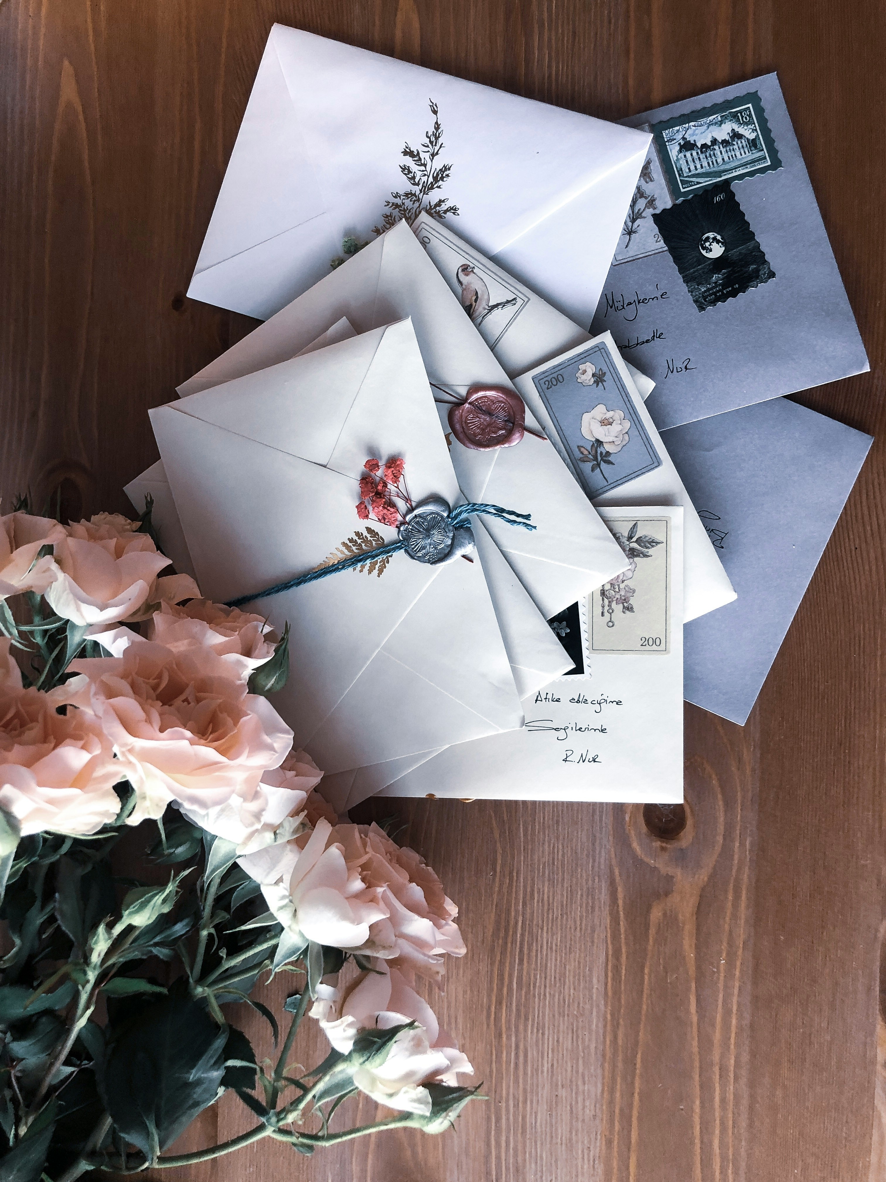 Wax-sealed wedding invitations with roses